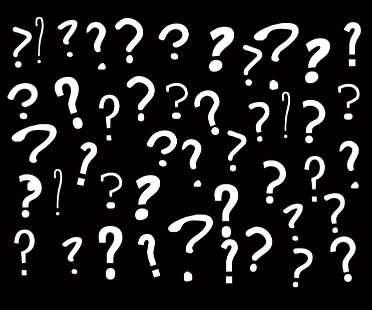 A blizzard of question marks on a black background